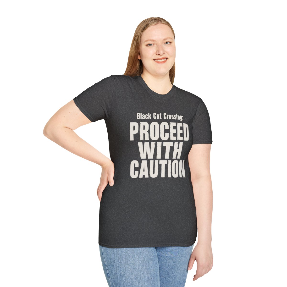 Black Cat Crossing: Proceed With Caution Halloween T-Shirt in Dark Heather, worn by a model (front view)